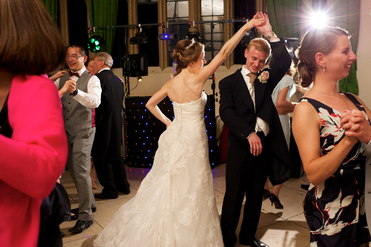 guests join timea and edmund on the dance floor at their wedding at leeds castle
