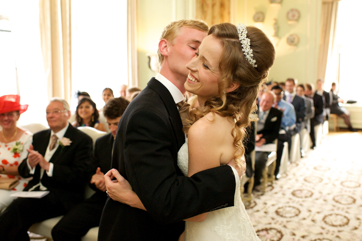 photograph of timea and edmund kissing during their leeds castle wedding ceremony