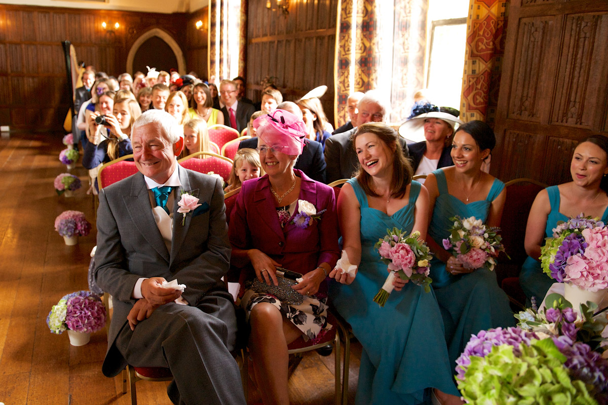 Photograph of wedding guests seated for Sarah and Leightons ceremony at Lympne castle in Kent