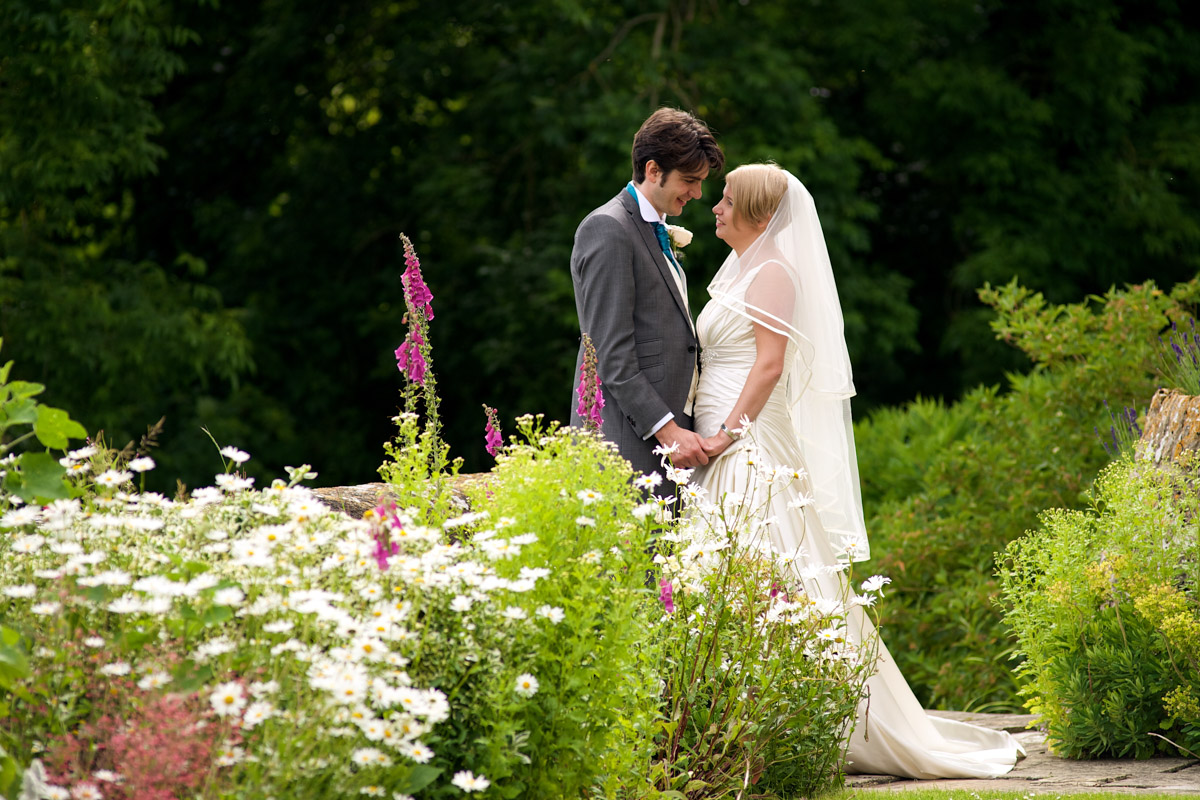 Photograph of Sarah and Leighton in the garden at Lympne castle in Kent on their wedding day