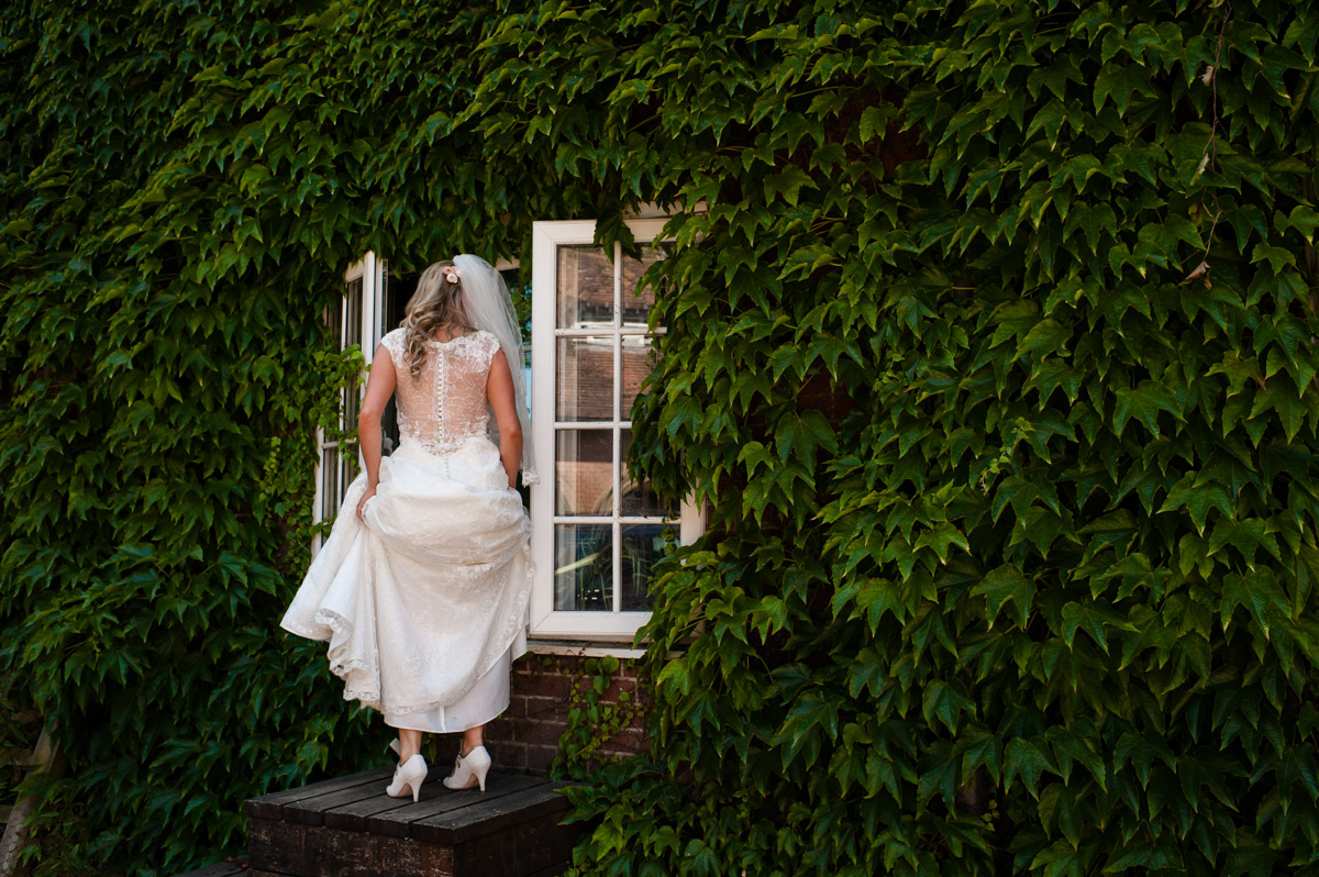 Bride waits to out horse at st augustines priory on her wedding day