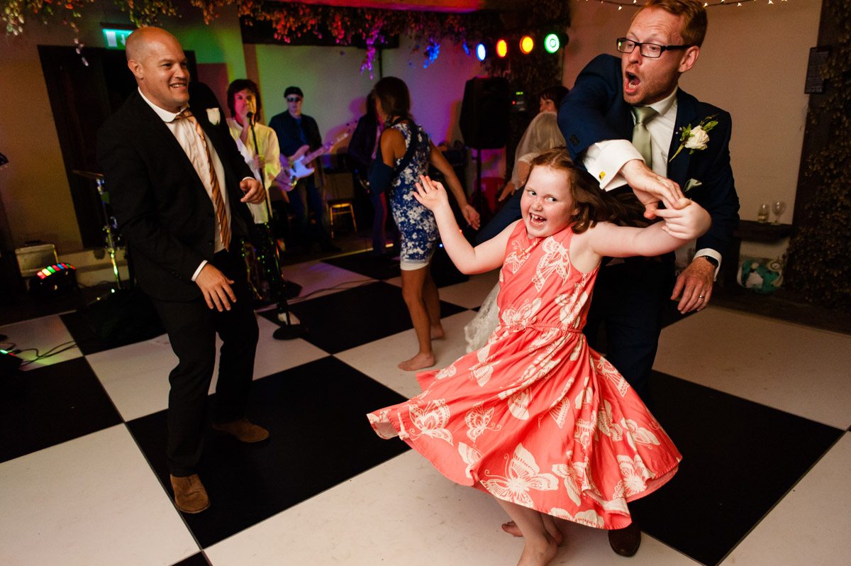 little girl dancing with groom at his wedding at st augustines priory in kent