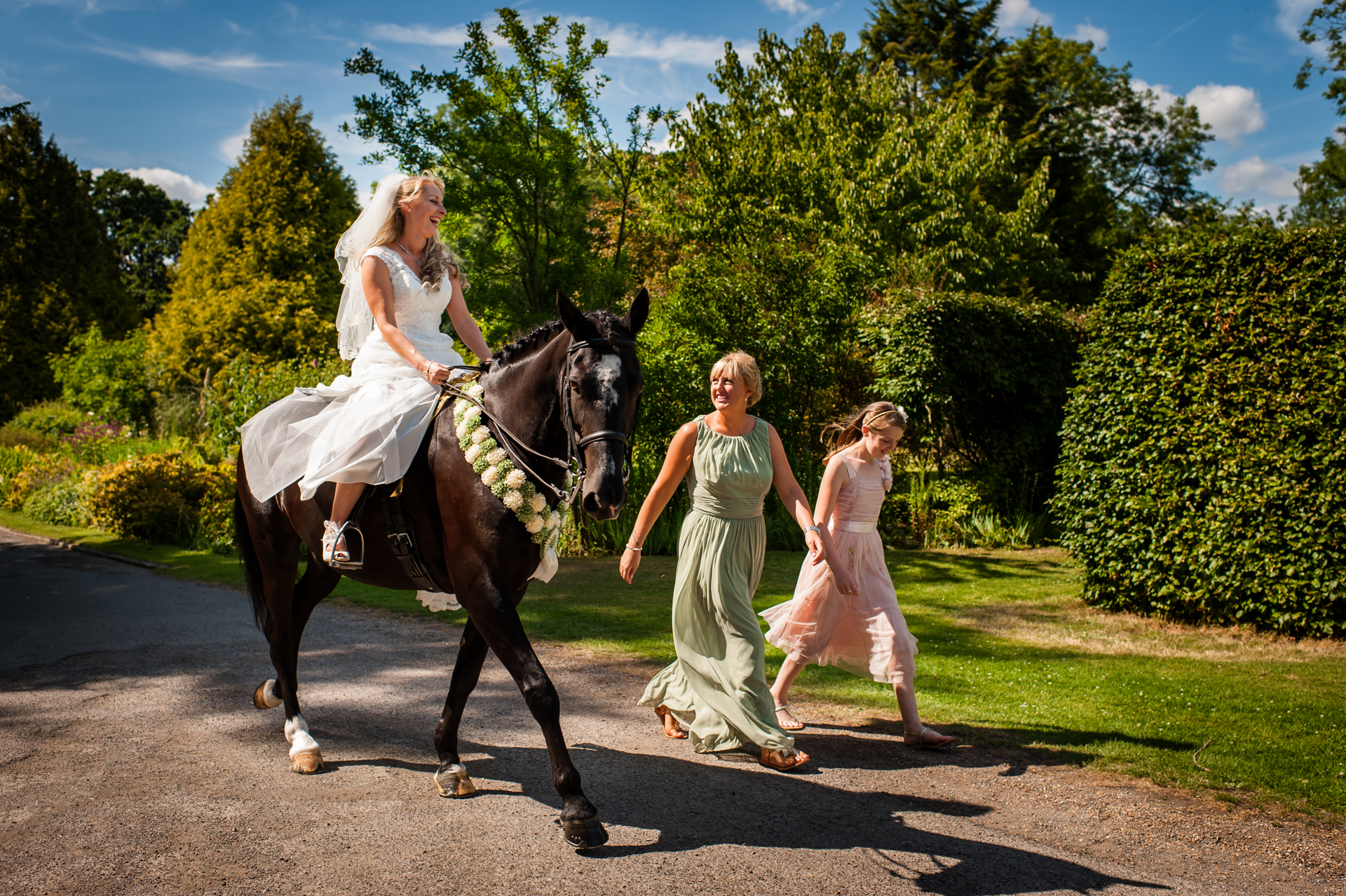 selina rides her horse down driveway at st augustines priory on her wedding day