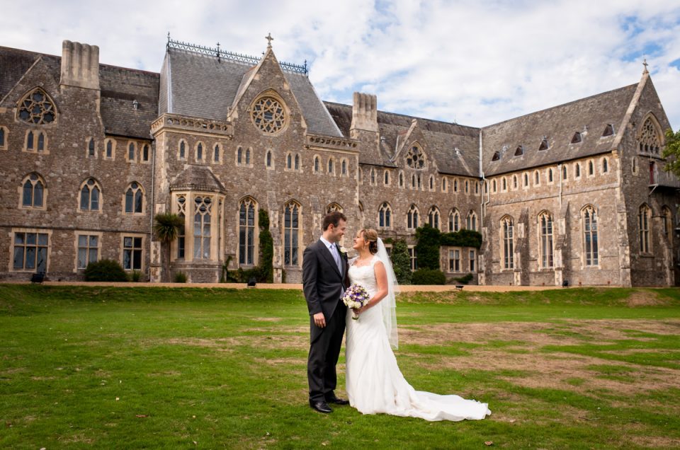 Photo of bride and groom outside St Edmunds School Chapel, Canterbury, on their wedding day