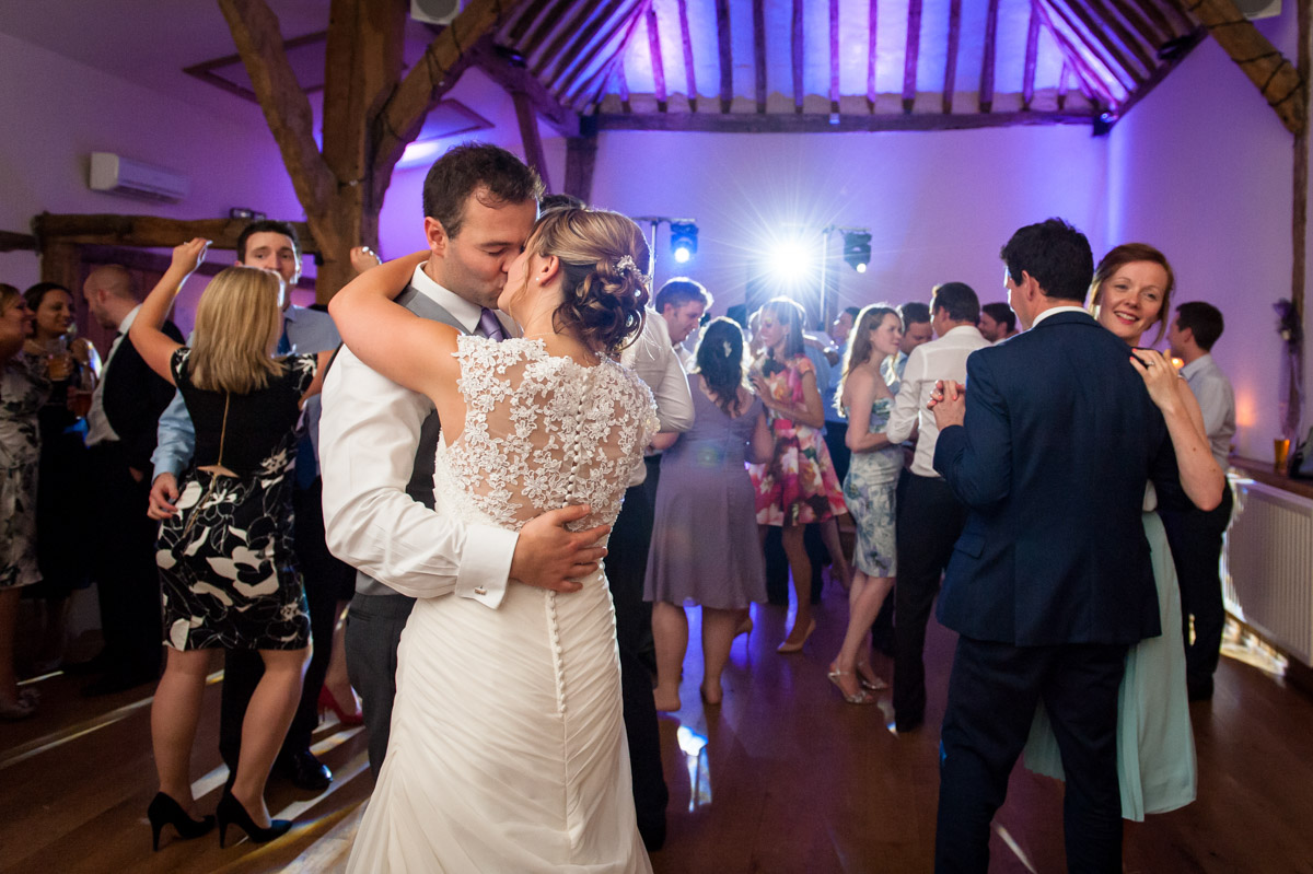 Wedding couple and guests dancing during reception at Winters Barn reception