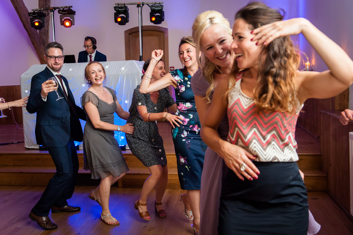 Guests do the conga at Winters Barn wedding
