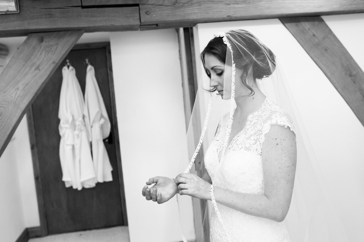 Bronwyn in her wedding dress before ceremony at the old kent barn