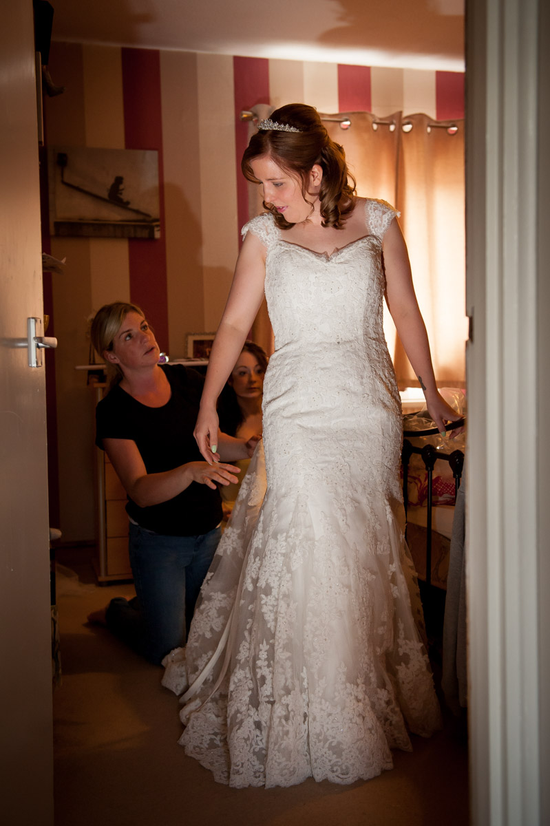 Photograph of Amy and wedding dress at home
