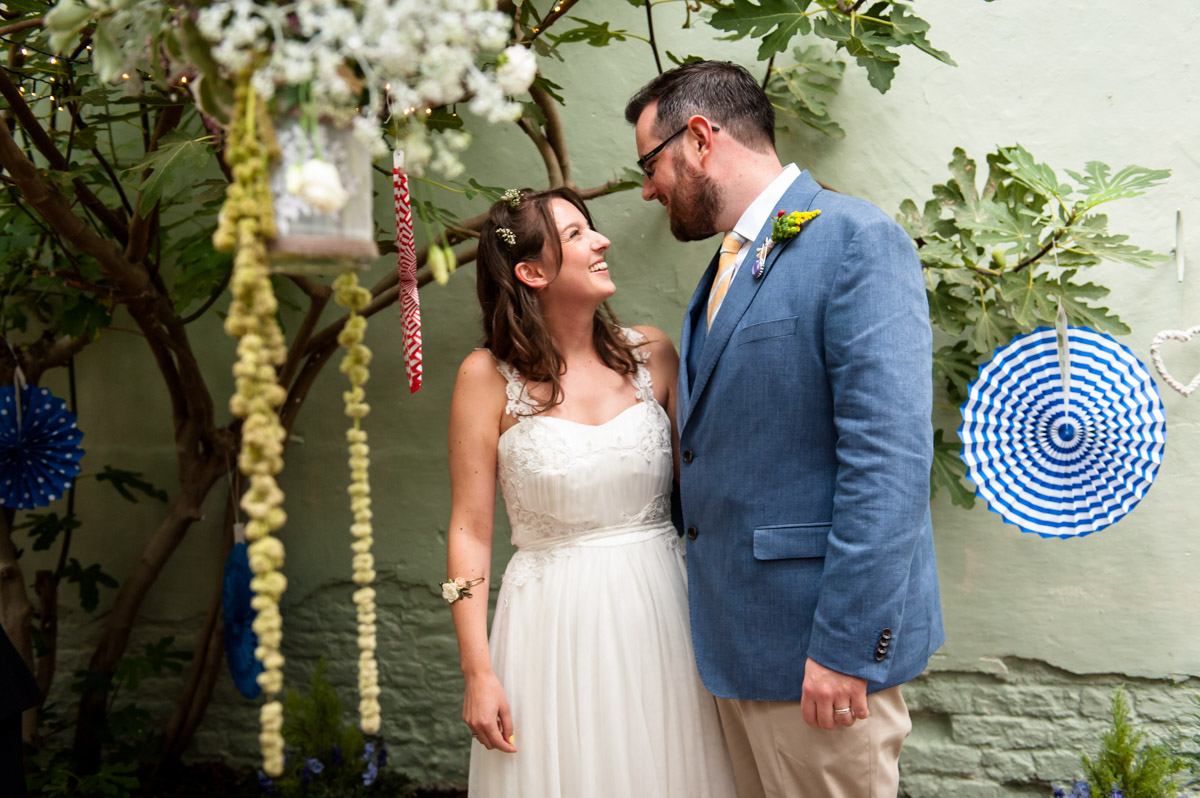 Rachel and daniel photographed during their glass house wedding at the secret garden in kent