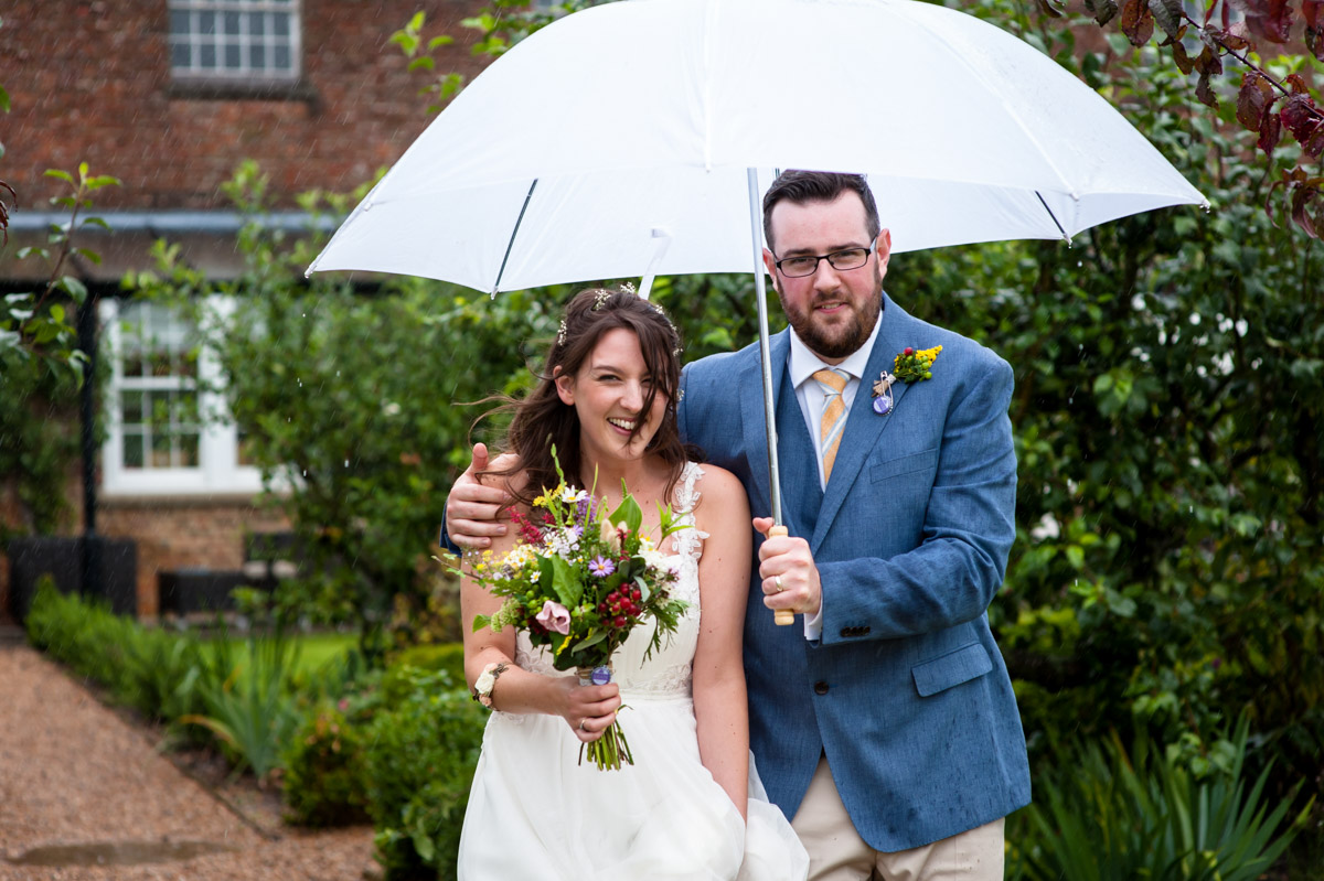 Rainy day wedding at the secret garden in kent
