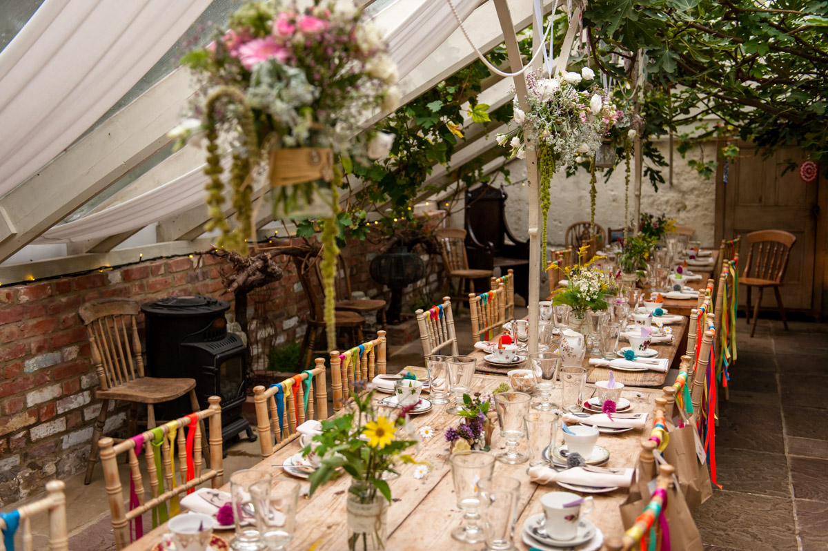 Inside the glass house at the secret garden, wedding table decorations