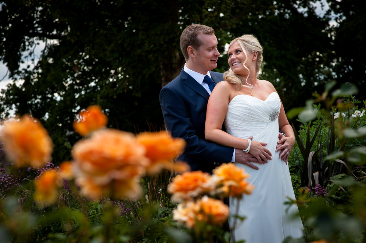 Photograph of Jay and Lauren in Whitstable gardens on their wedding day
