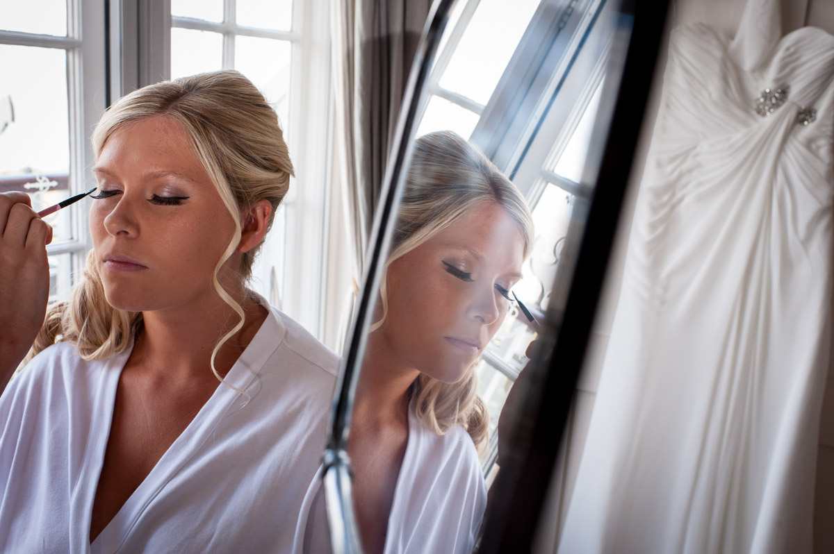 Lauren is photographed having her make up done before the wedding at Whitstable Castle