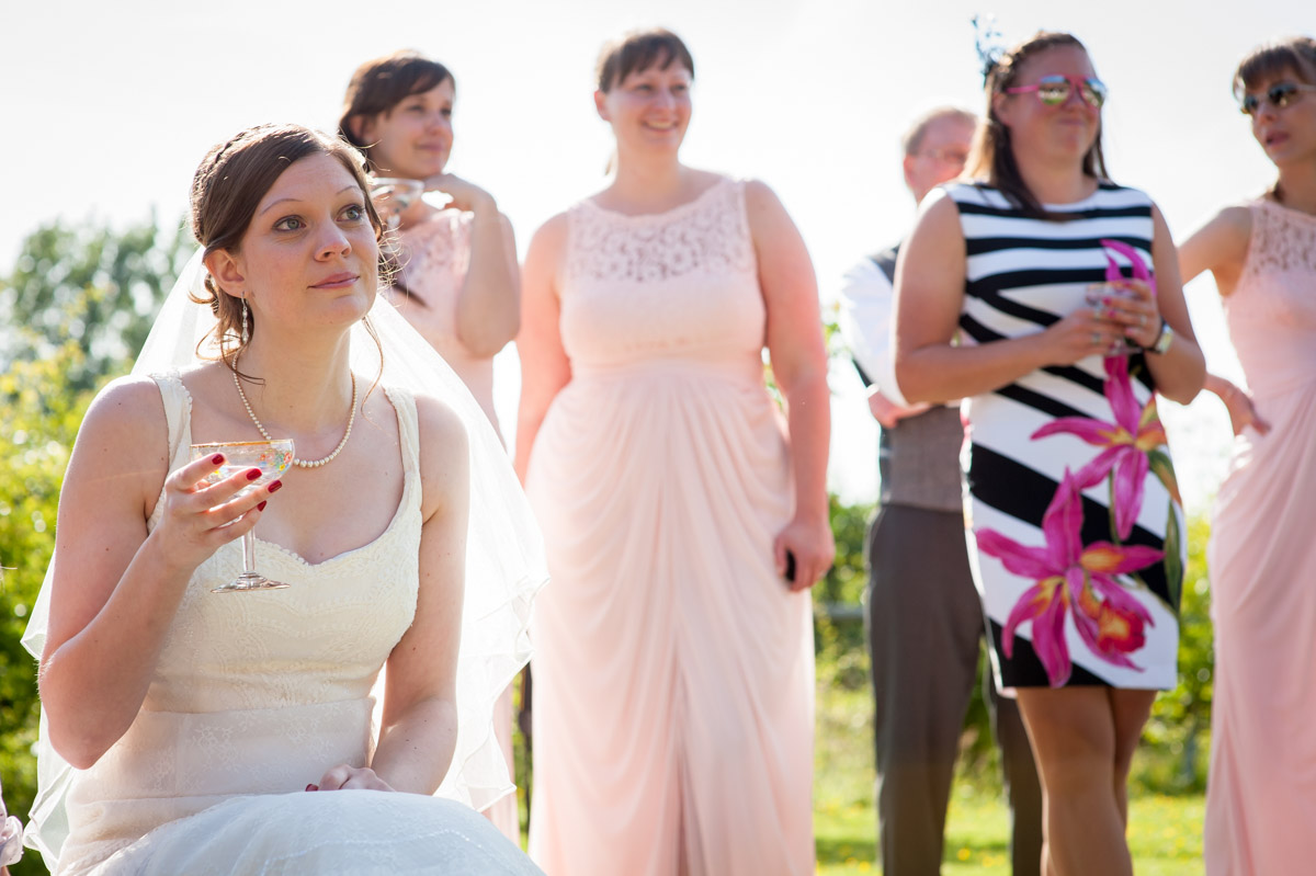 gaby and bridesmaids listen to wedding speeches