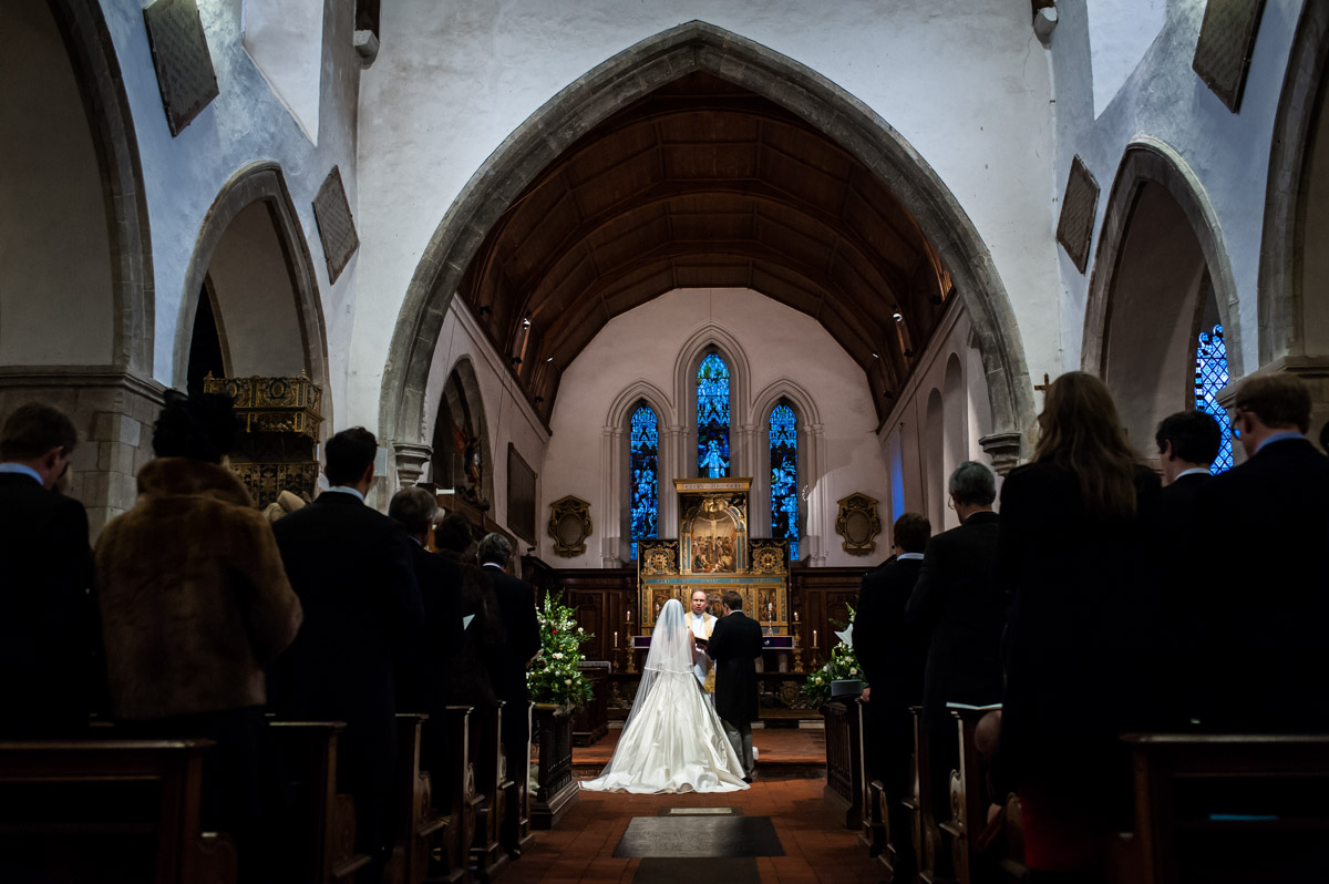 Photograph of Marcus and Frances from the back of the church during their wedding ceremony