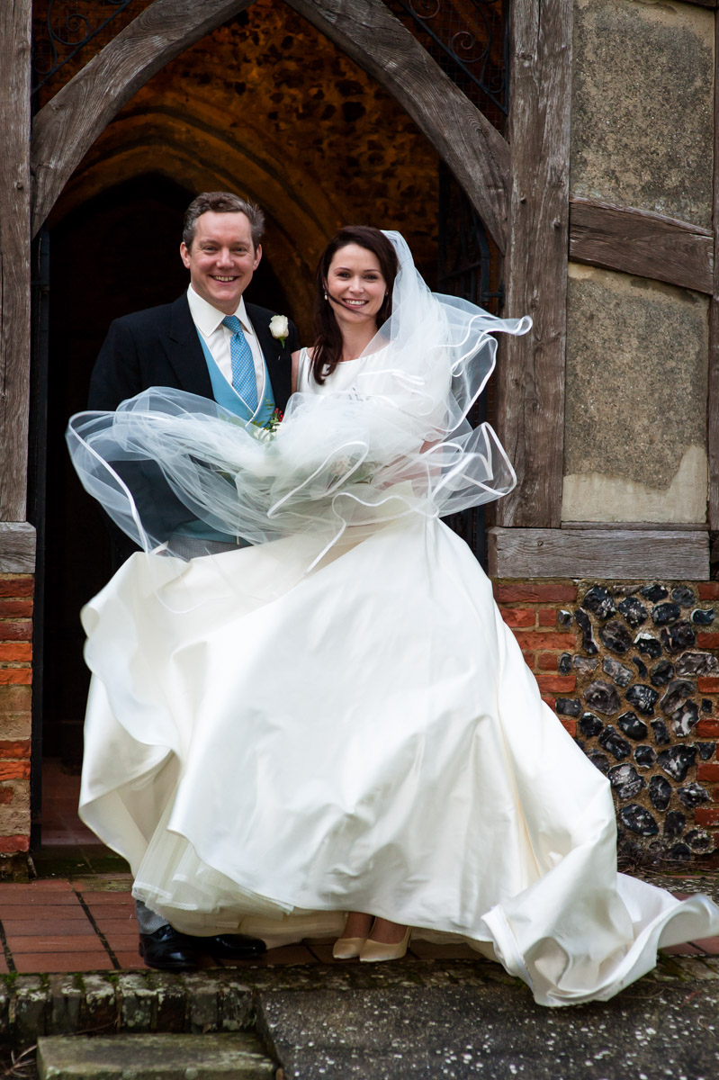 Marcus and Frances photographed together outside Elham church on their wedding day