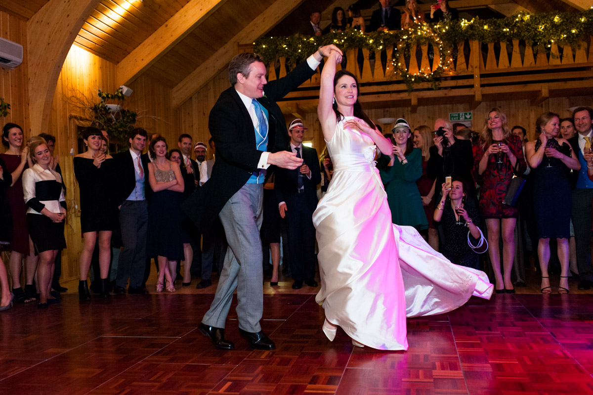 Frances and Marcus are photographed performing their first dance at their wedding reception in Wootton Village hall in Kent