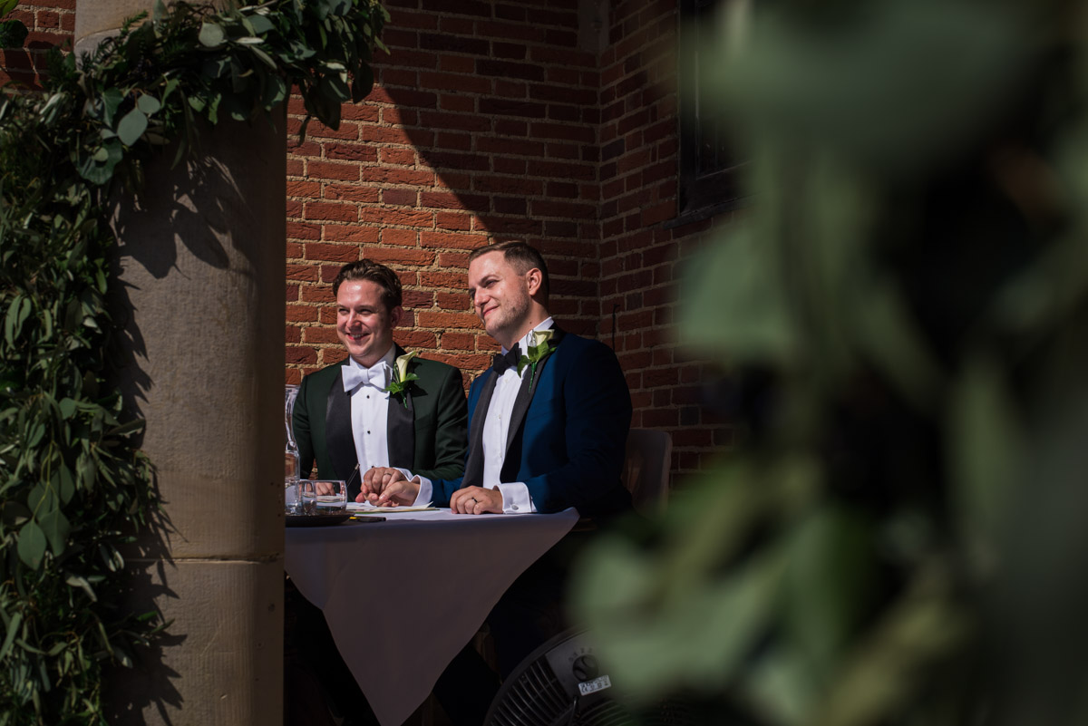 Photograph of david and Simon signing the wedding register
