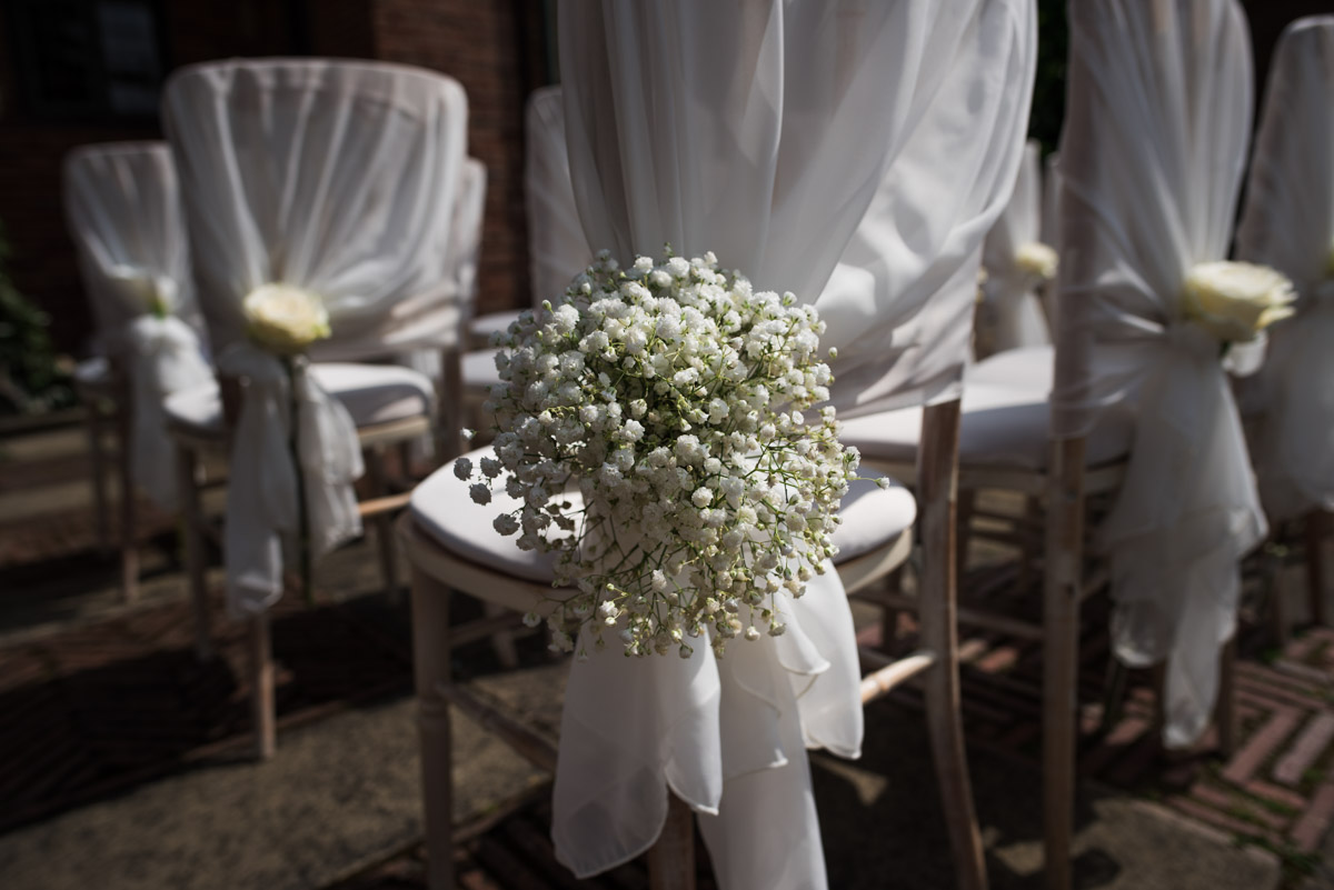Photograph of chair decorations at David and Simons Port Lympne wedding in Kent