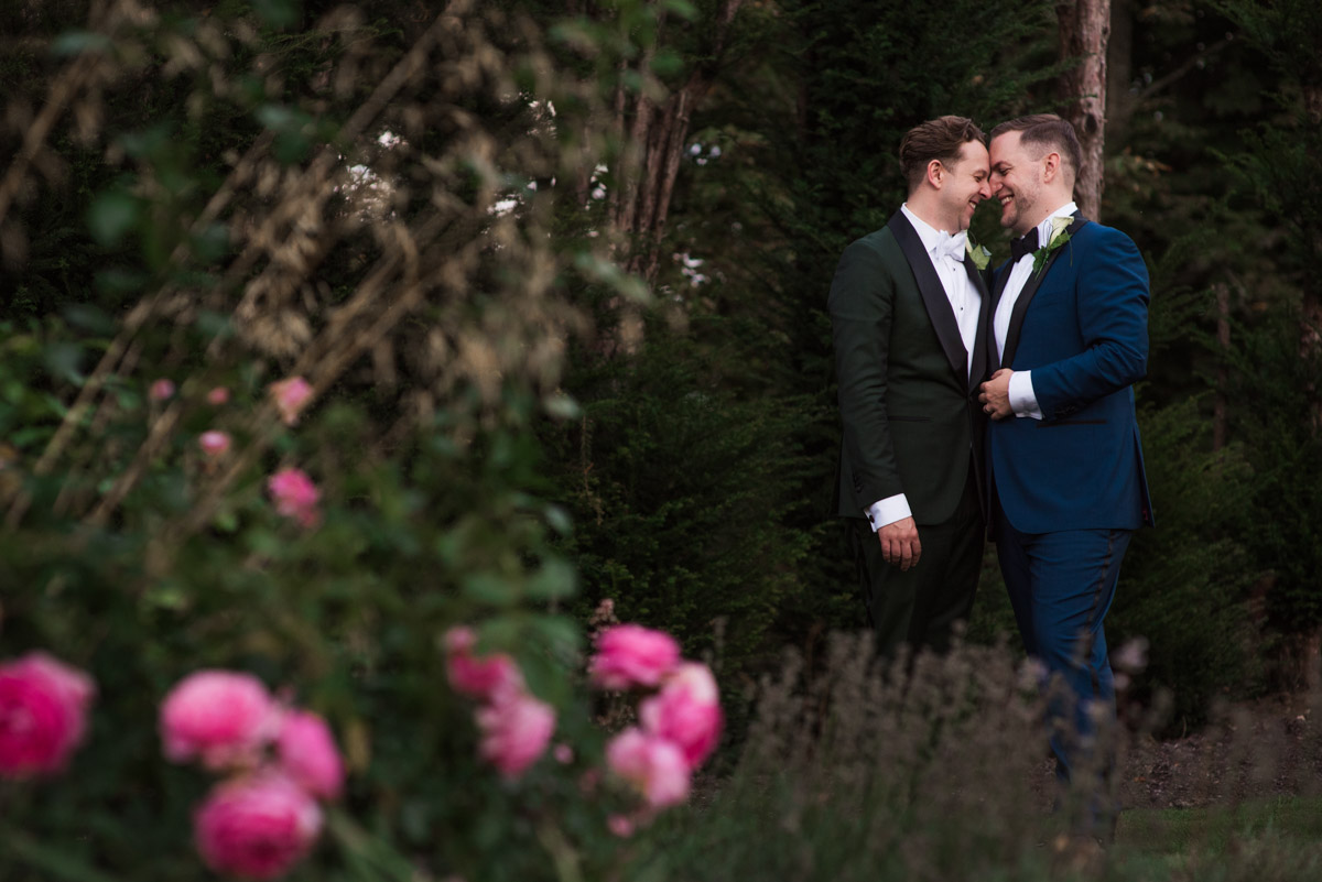 Photograph of David and Simon together in the gardens of Port Lympne Mansions in Kent on their wedding day