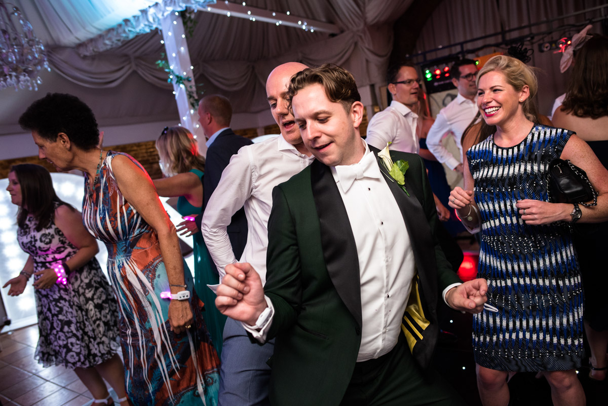 David is photographed dancing with wedding guests at Port Lympne Mansions in Kent