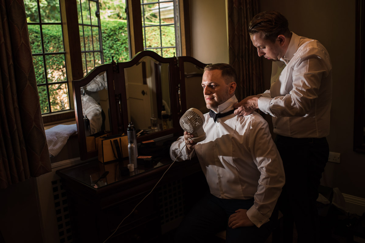 Simon is photographed getting ready for his Kent wedding at Port Lympne Mansions