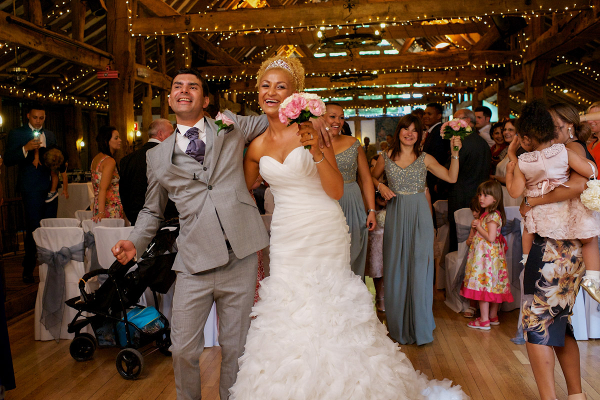 Judy and Rick dance their way down the aisle after their Tunbridge wells wedding in Kent
