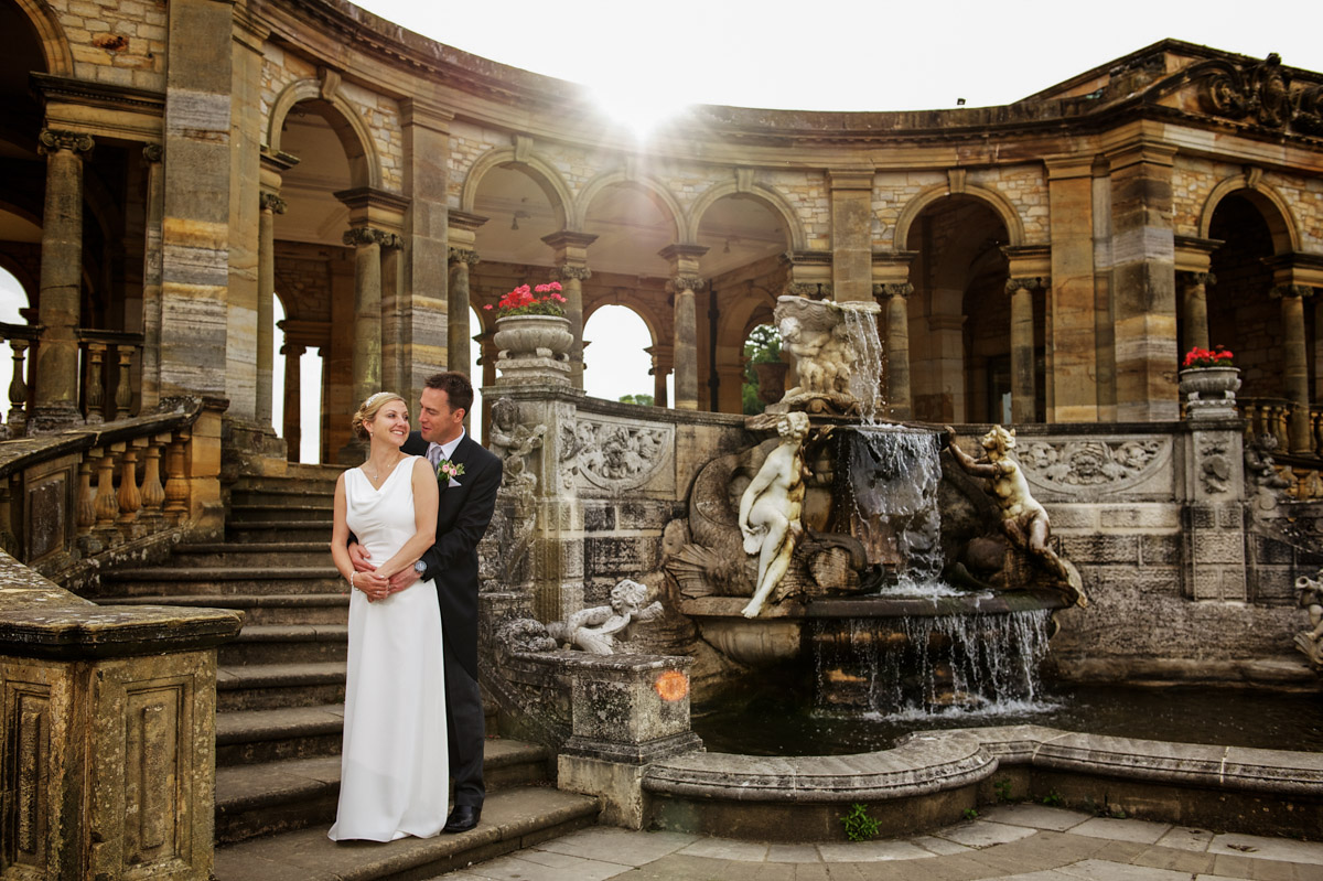 gail and John are photographed by the fountain at their Hever castle wedding in Kent