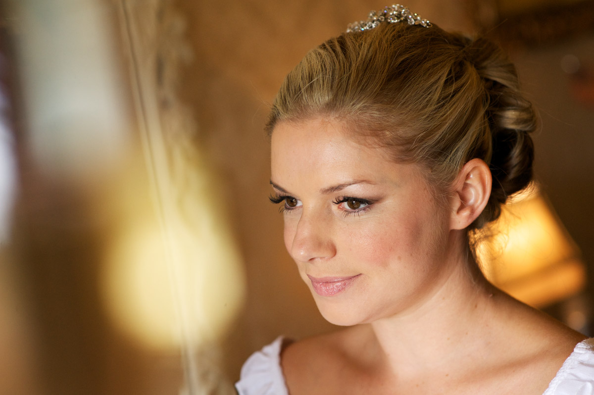Emma is photographed at Kent wedding venue The Old Kent Barn getting ready before her big day