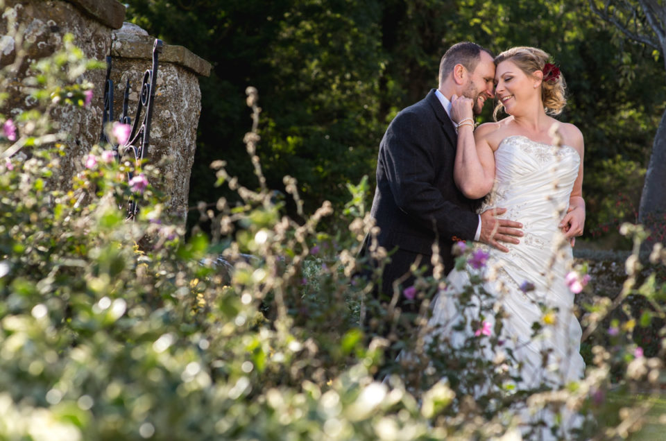 Photograph of John and Lianne in the grounds at Lympne Castle during their wedding day