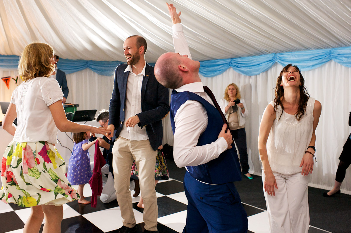 Juliette and David photographed on the dance floor at their wedding party in Kent