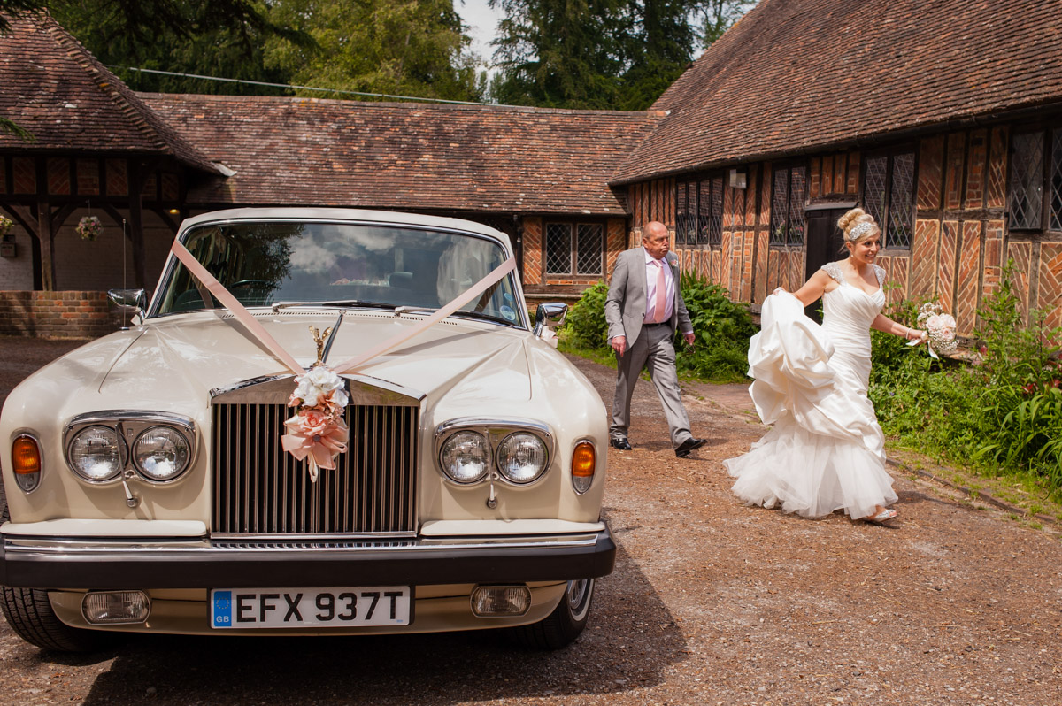 Emily and dad arrive for her wedding in Kent venue Chilham Village Hall