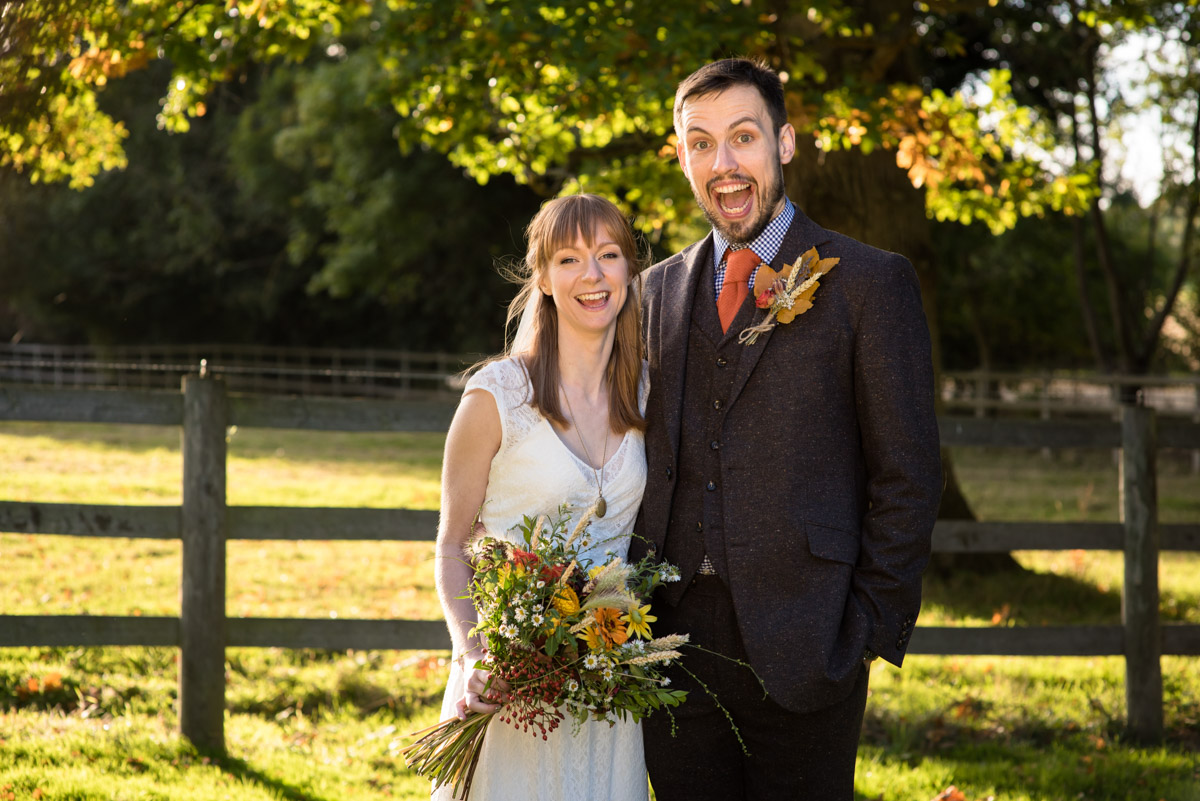 Photograph of Paul and Laura in the grounds of Chilahm Village Hall in Kent on their wedding day