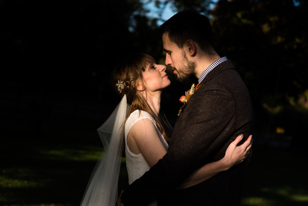 Photograph of Paul and Laura together lit by late afternoon sunshine on their wedding day