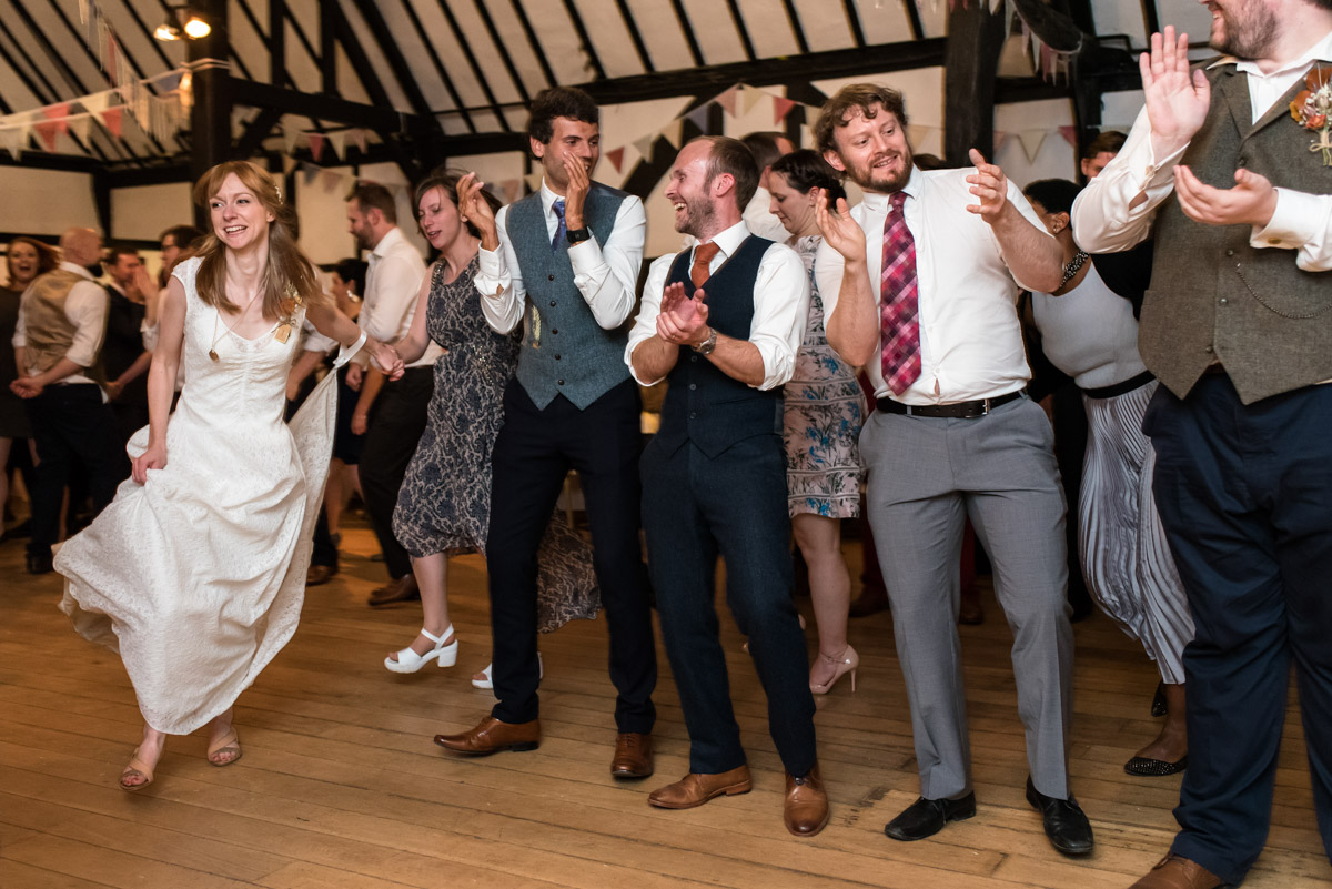 Photograph of Laura and her wedding guests during the ceilidh