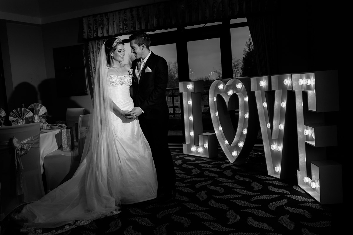 Black and white wedding photograph of Jade and Stuart at Dale Hill Golf Club