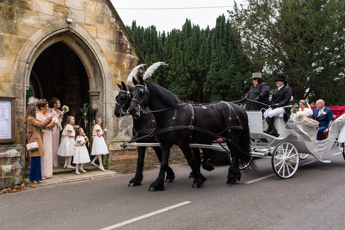 Photograph of Jade arriving for her church wedding in Kent in horse drawn carriage