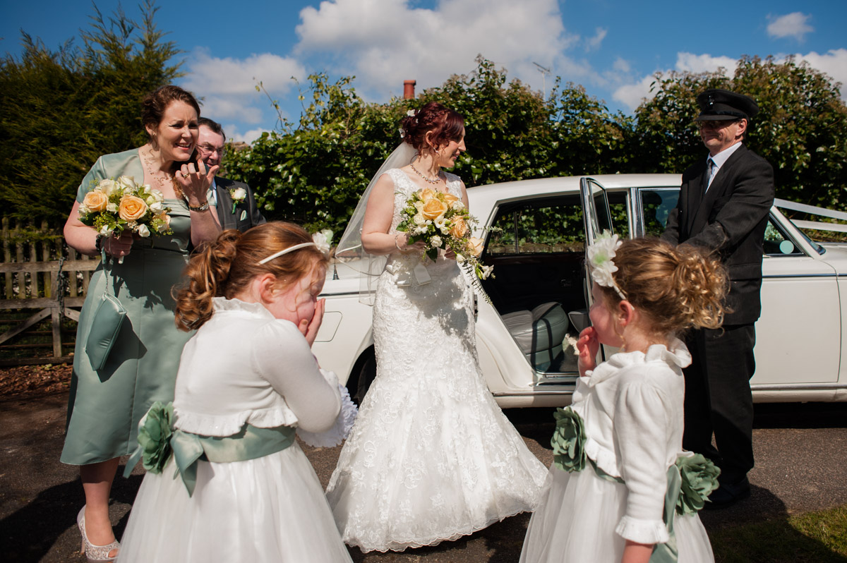 Charlotte and her bridesmaids and flower girls arrive at church for her wedding in Kent