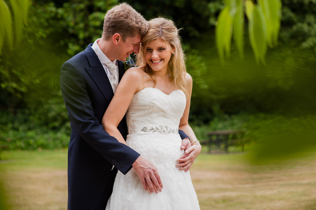 Photograph of Heidi and James in the grounds at the Ward Rooms in Kent on their wedding day