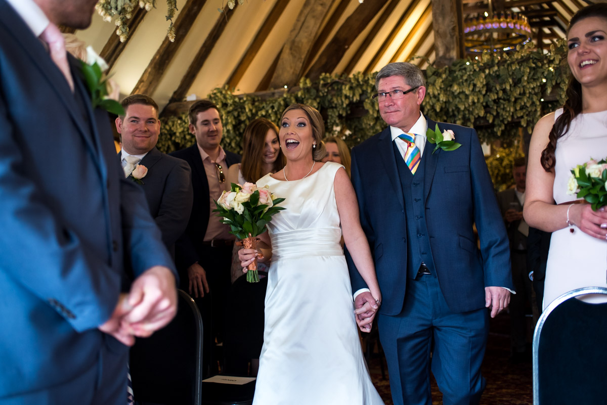 Photograph of Louise and her dad during her wedding at The Shepherd Neame Brewery in Kent