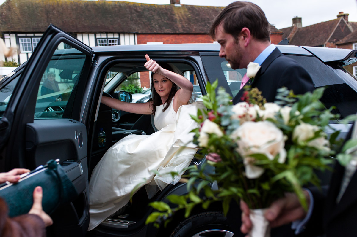 Frances the bride gives a thumbs up on her wedding day in Kent