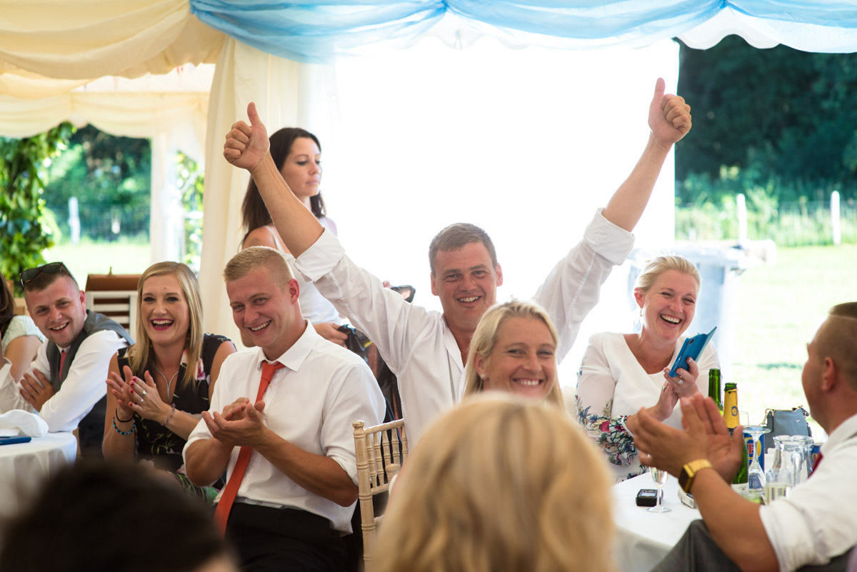 Wedding guest photographed giving thumbs up during Kif and Beckys speech