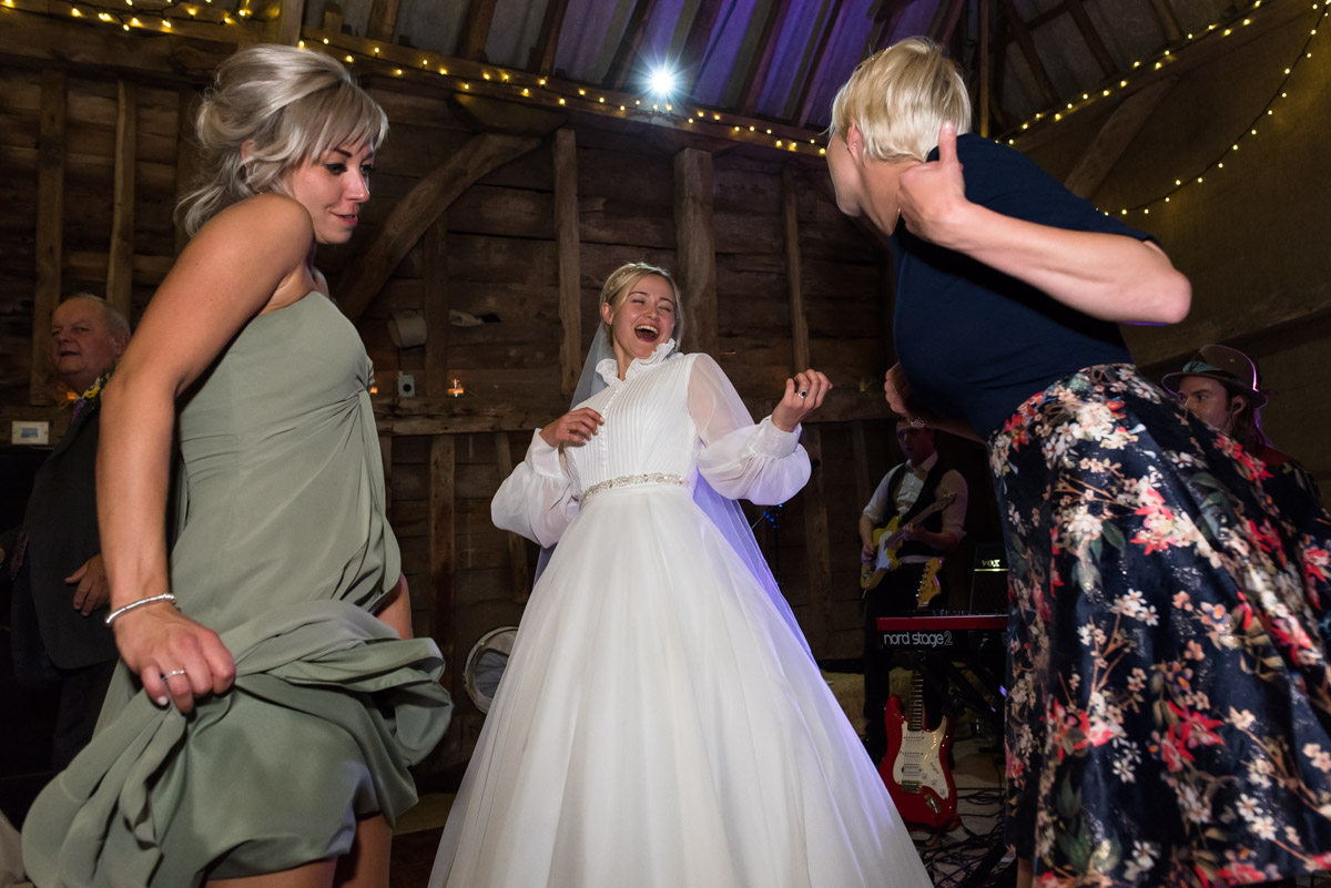 Photograph of Jane dancing at her Chilham church wedding reception
