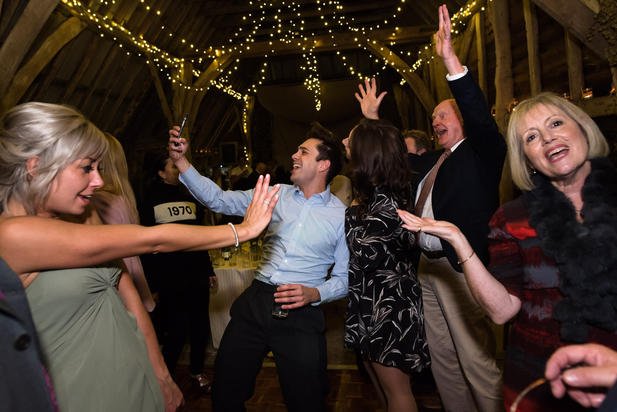 Guests enjoy the wedding dancing on Jane and Stevens chilham church wedding day in Kent