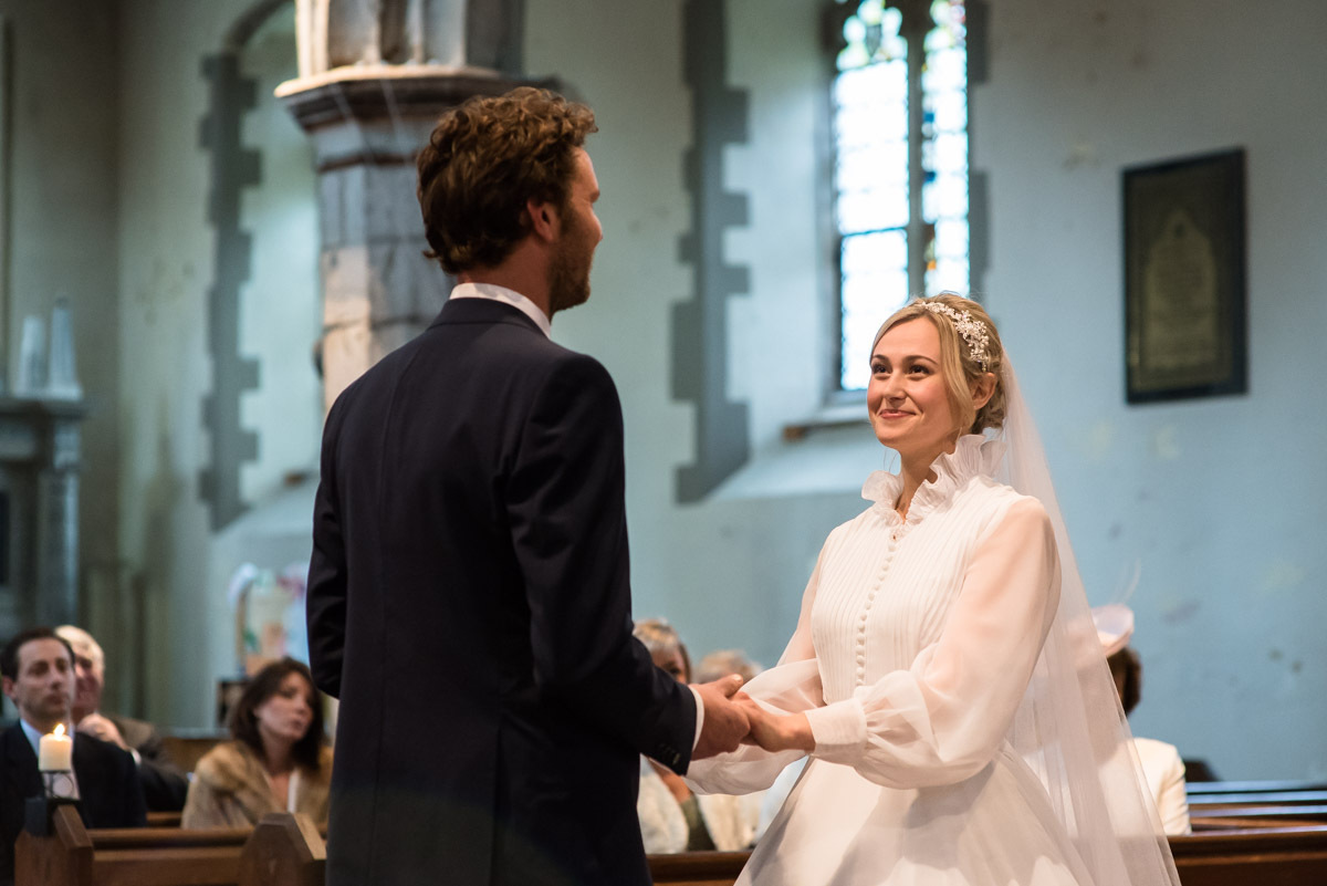 Photograph of Steven and Jane in Kent church taking their wedding vows