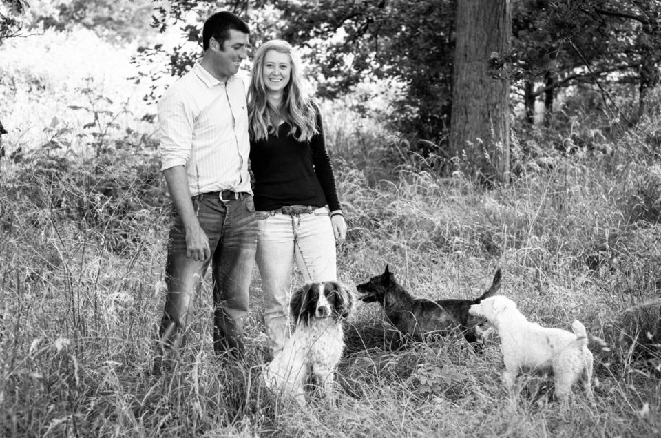 Photograph of Becky and Kif and their three dogs