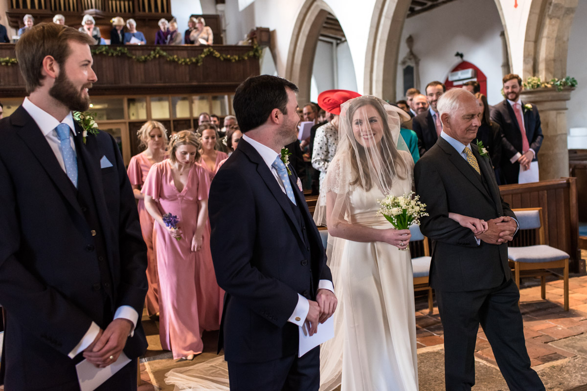 Brenchley Kent wedidng photography of Flora and James during ceremony
