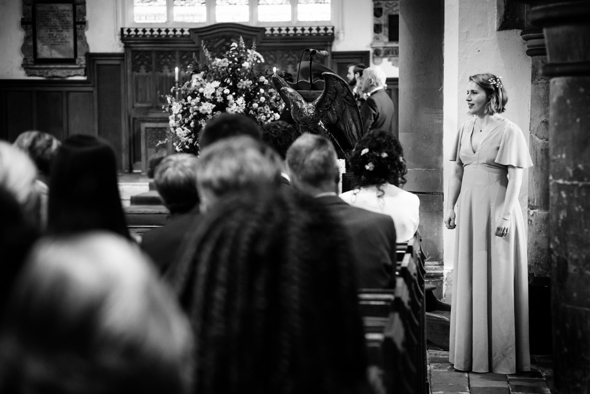Alice is photographed singing at her sister Brenchley church wedding in Kent