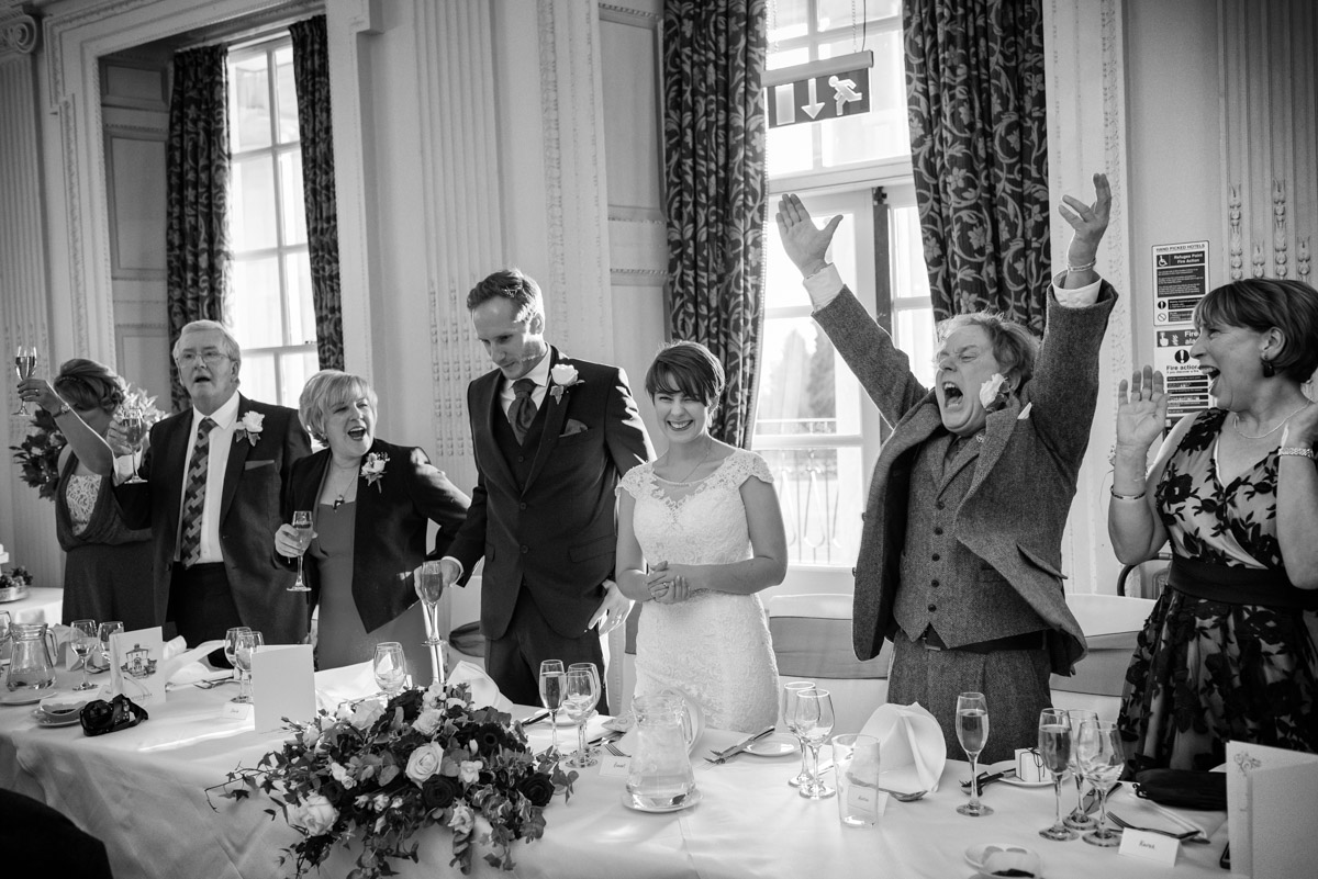 Buxted Park Hotel wedding photograph of speeches at Joe and Bennets reception