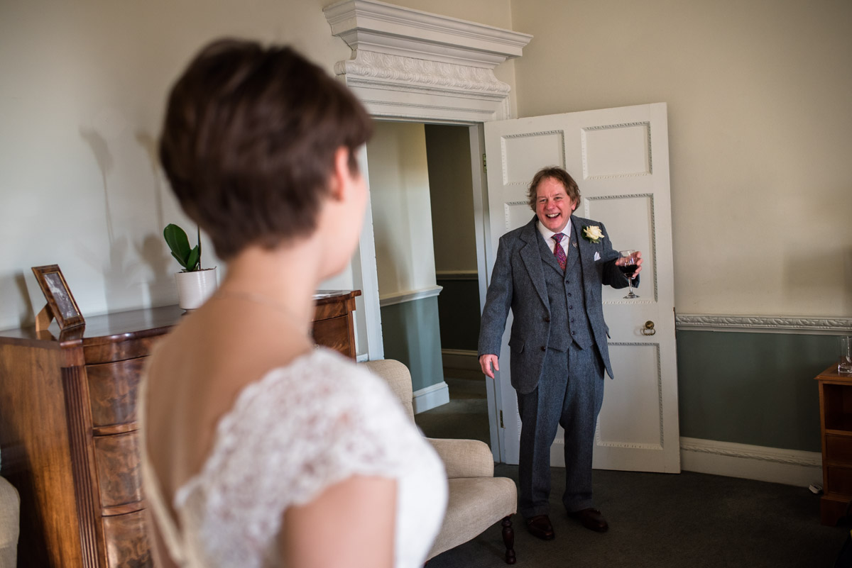father sees his daughter in wedding dress for first time at Buxted Park Hotel